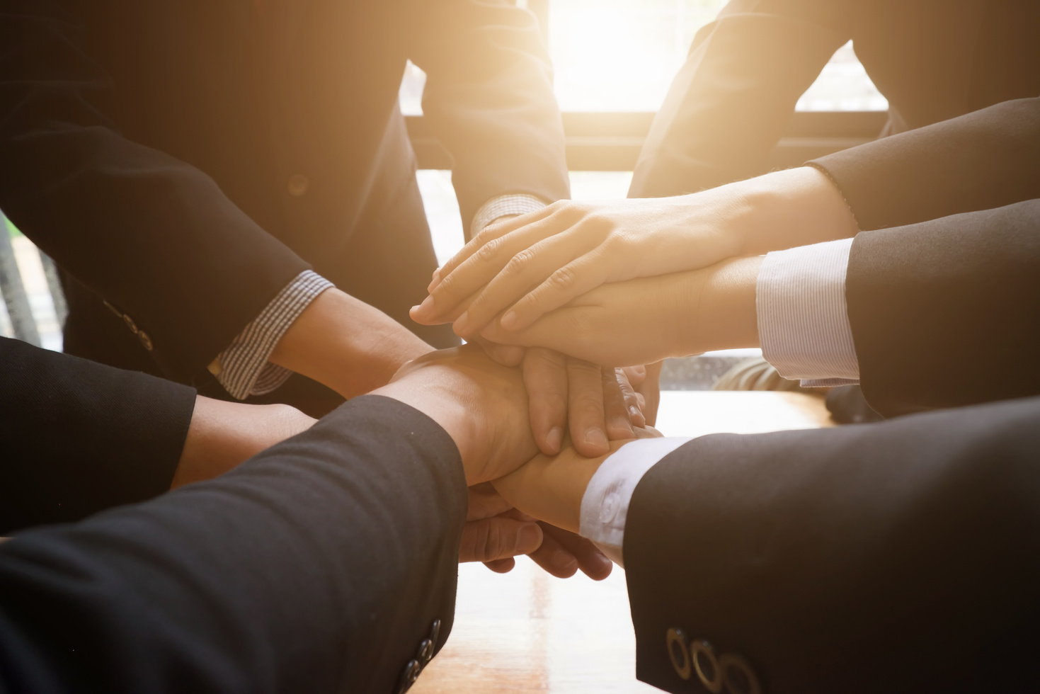 Group of Business People Joining Hands Together